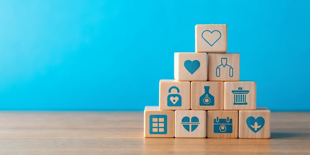 health-insurance-concept-with-wooden-blocks-medical-icons-blue-background-copy-space